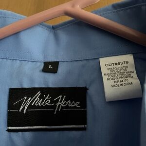 NWOT women’s western shirt in purple. Never worn. Size Large.